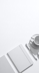 Fototapeta premium Minimalist Workspace with Stationery and Coffee Cup on White Background