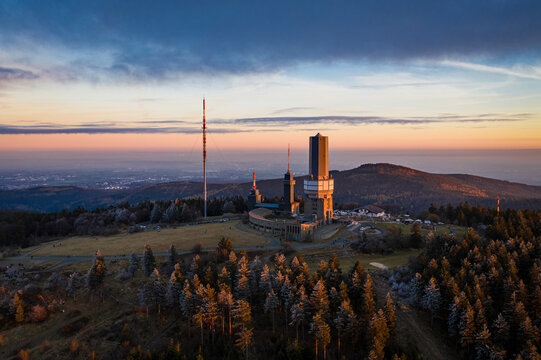 Aerial view of the Grosser Feldberg tower, where the forest's dark greens meet the sky's soft pastel hues., Schmitten im Taunus, Hessen, Germany.