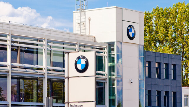 Riga, Latvia - May 27, 2024: BMW dealership, pictured building and company logos, blue sky in the background
