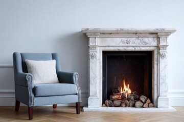 Comfortable upholstered armchair sits beside an elegant marble fireplace with a warm wood fire burning