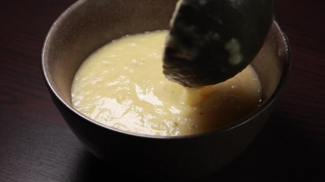 creamy potato leek soup served in a bowl, perfect for cozy winter meals