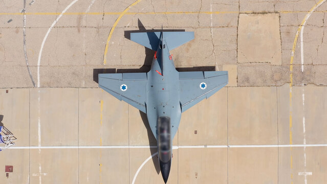 
Israeli Air Force F-16I Sufa

Top down aerial view of an Israeli Air Force F-16I Sufa fighter jet parked on an airbase apron, Israel, November 2025.
