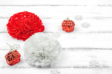 Traditional New Year composition. Festive decor, handmade paper flowers, gift idea. Holiday time