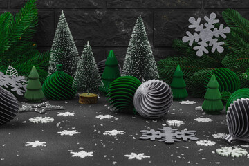 Creative New Year concept. Christmas composition, festive decoration, handmade balls and firs