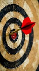 Bullseye hit with dart in a worn dartboard center