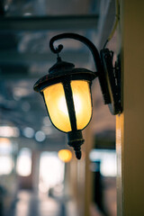 Vintage style wall lamps emit warm light that creates a comfortable and elegant atmosphere.