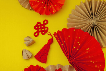 Happy Chinese New Year traditional concept. Oriental asian style paper fans on red background