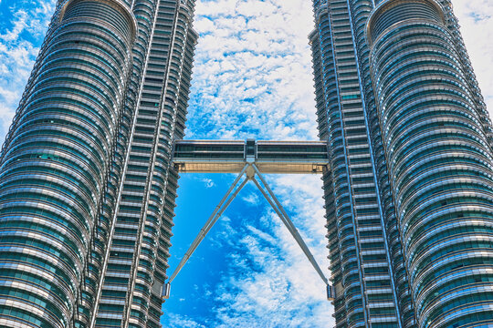 KUALA LUMPUR, MALAYSIA - SEPTEMBERER 14, 2025: Petronas Towers. Petronas Towers, also known as Menara Petronas is the tallest buildings in the world from 1998 to 2004. On a hot day during wet season.