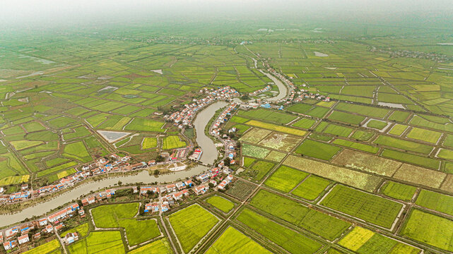 Aerial View of Agricultural Fields and Rural Settlement Along River