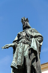 Obraz premium Monumental neo-Gothic statue of Emperor Charles IV from 1844 holding a sword and university charters, Krizovnicke square on the foot of the Charles bridge, Prague, Czech republic
