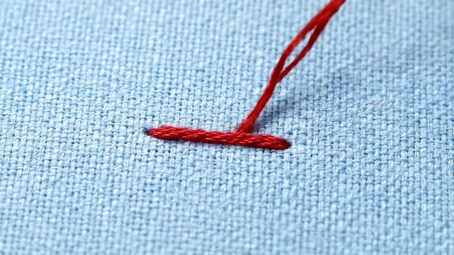 Red embroidery on blue.