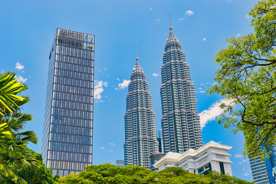 KUALA LUMPUR, MALAYSIA - SEPTEMBERER 14, 2025: Petronas Towers. Petronas Towers, also known as Menara Petronas is the tallest buildings in the world from 1998 to 2004. On a hot day during wet season.