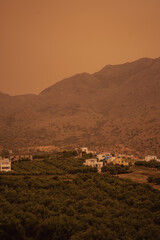 Obraz premium Meteorological event: african sand and poor visibility creating a dense orange haze over crete