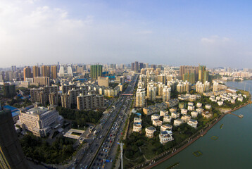 Naklejka premium Modern City Panorama with River and High-Rise Buildings - Aerial View