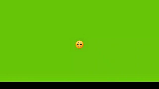 Sad emoji on green screen background with unhappy expression
