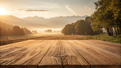 Fototapeta premium Wooden table foreground with misty mountain sunrise landscape background