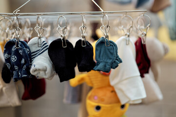 Baby clothes and accessories hanging