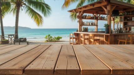 Empty wooden table top with blurred tropical beach bar, ocean, and palm trees in the background