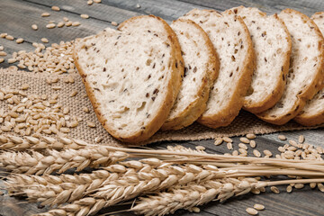 Whole grain and seeds sliced bread. Fresh bakery products. Design a poster for a kitchen or bakery.