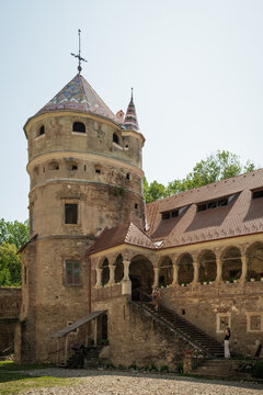 View of the Bethlen Castle's weathered stone tower rises majestically against the clear sky, showcasing its intricate architecture, Cris, Transilvania, Romania.