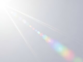 A beautiful rainbow light beam shining through the sky with sun rays