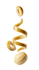 Uncooked Italian pasta shapes isolated on black background, spiraled and ring noodles floating, perfect for cooking or culinary design