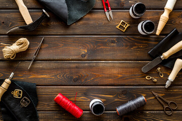 Leather craft or shoemaker tools flat lay. The workplace in a leather workshop