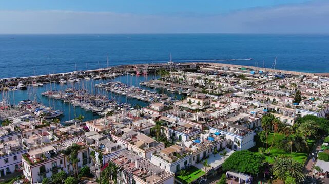 Puerto de Mogan, Gran Canaria, Canary Islands, Spain: Aerial view of marina in famous tourist resort, summer sunny day - landscape panorama of Atlantic Ocean islands from above
