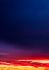 Fototapeta premium Sunset sky with vibrant colors and dramatic clouds – perfect nature background for commercial use. Abstract Orange Red Gradient