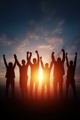 Group of diverse people celebrating victory at sunset