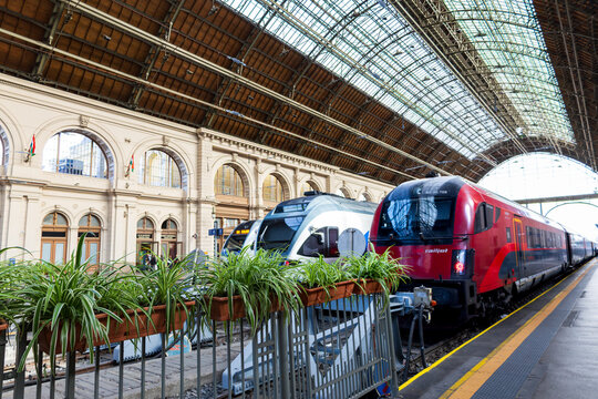 Budapest, Hungary, October 6, 2025 - A red Railjet train and others parked in the historic downtown 1884 Keleti station&nbsp;in the eight district
