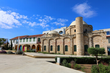 Fototapeta premium Zouhouri Mosque standing in the city of Larnaca, Cyprus. White domes of Zouhouri Mosque rising above the rooftops in Larnaca, Cyprus