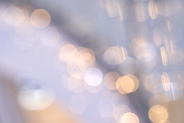Soft focus abstract background with golden and silver bokeh lights for elegant holiday or celebration theme. © elenavolf