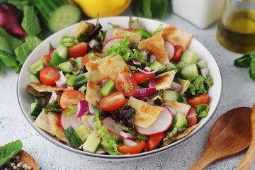 A bowl with Fattoush - Traditional Levantine salad	