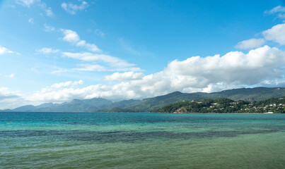 Panoramic view of the southern coast of Mahe with emerald ocean and lush tropical forest