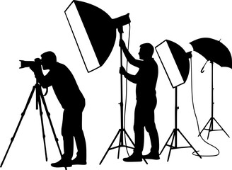 Silhouette of two photographers with studio lighting equipment in a photography session setting on white
