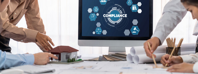 Group of interior architect designer discussing together on blueprint and laptop screen display...