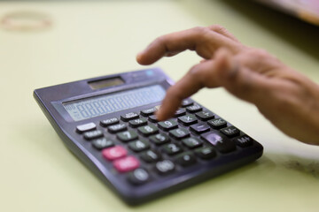 Using a calculator for basic calculations in an office
