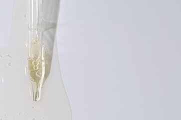 Liquid cosmetic product for the skin or medicine in a pipette. Copy space