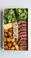 Delicious Bento Box Featuring Steak, Sushi, and Fresh Salad