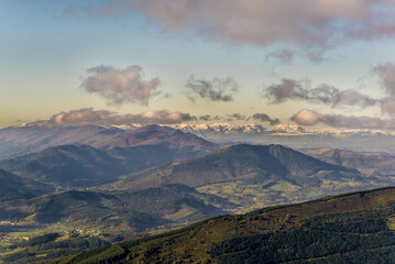Panoramic view from Eretza mountain to Pico de la Cruz and Cantabria peaks, Lush green slopes