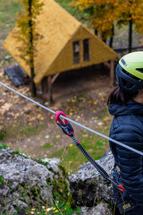 Via ferrata. An unidentified person climbs in the mountains  with the help of fixed safety ropes....