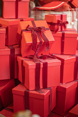 Gift boxes piled in a heap. Mountain of Christmas gifts close-up.