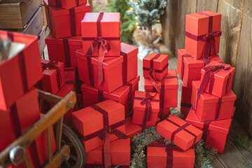 Gift boxes piled in a heap. Mountain of Christmas gifts close-up.