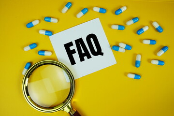 FAQ with medicine capsule and magnifying glass on yellow background