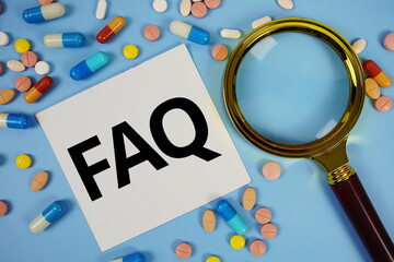 FAQ with Various Colored Pills and magnifying glass on blue background