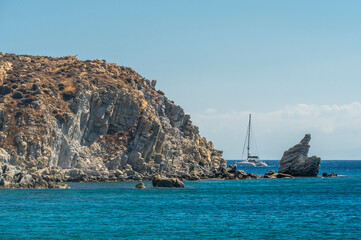 Rocky Sea Stack and Cliff Rising from Turquoise Blue Sea