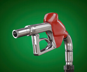 Red gasoline pump nozzle isolated on green studio background