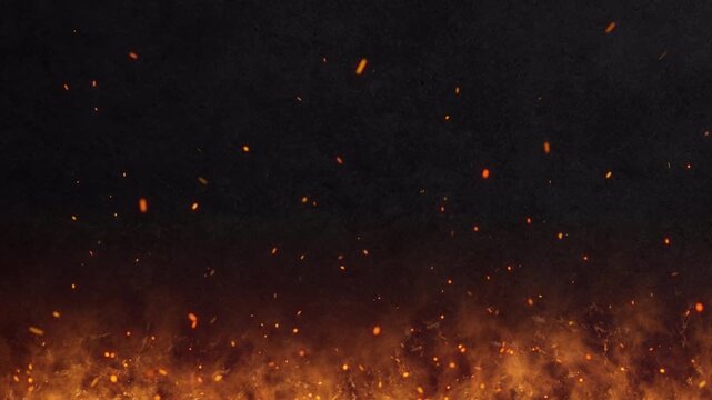 Abstract orange fiery sparks and smoke from a bonfire with fire, abstract background.