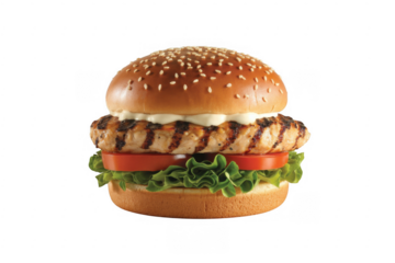 Grilled chicken sandwich with lettuce tomato and mayonnaise on a sesame seed bun burger isolated on a transparent background